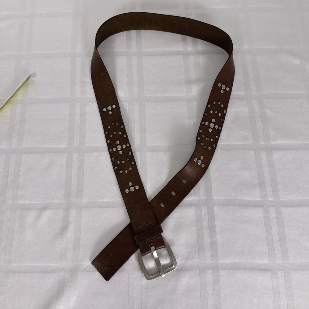 Dark Brown Leather belt with silver buckle and accents. Size XL
